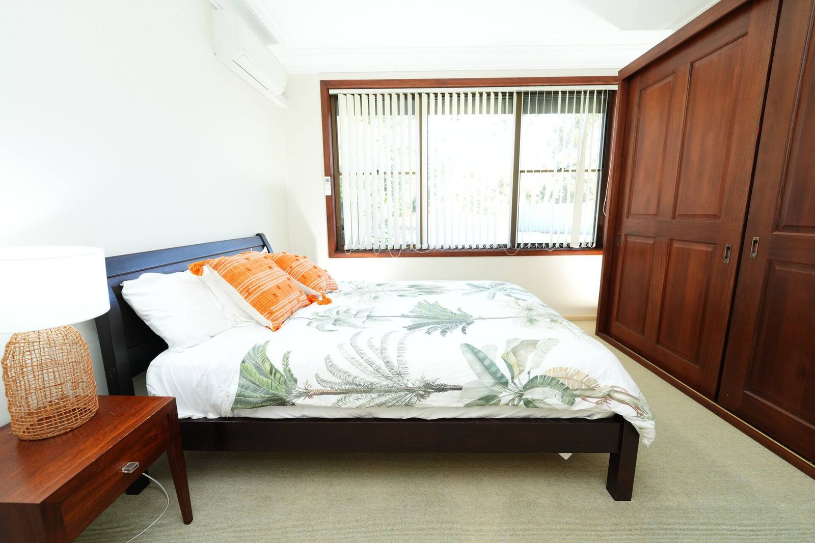Queen bedroom with wardrobe and air conditioning
