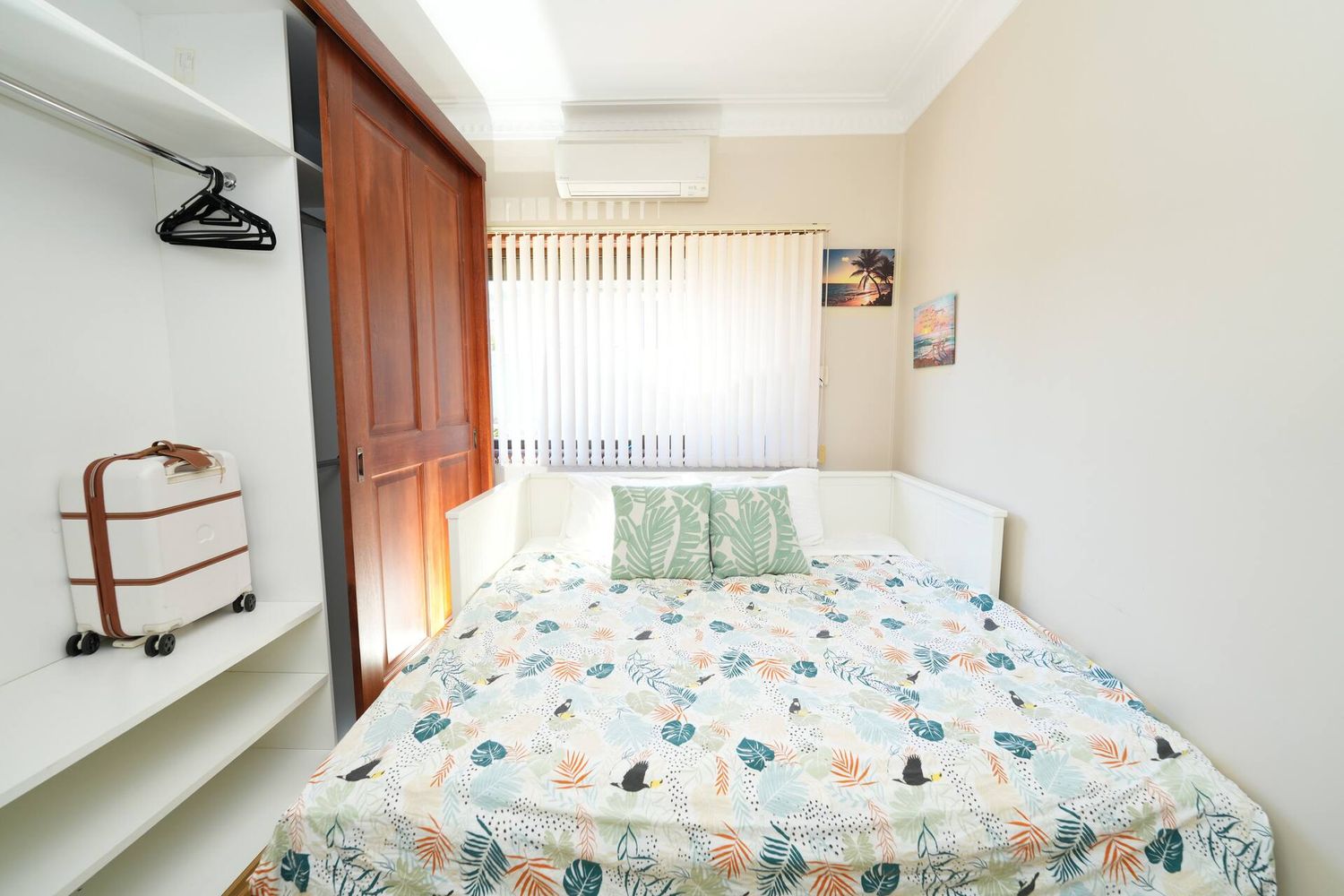 Queen bedroom with open shelving and hanging space