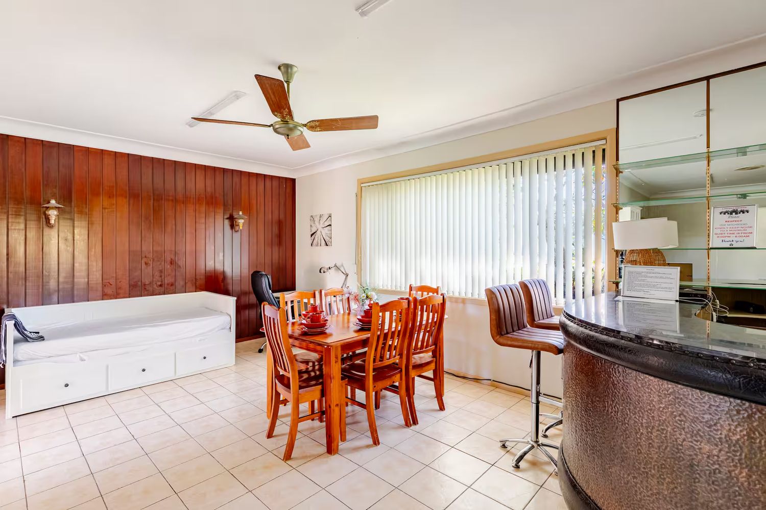 Dining room with a white sofa bed against the wall