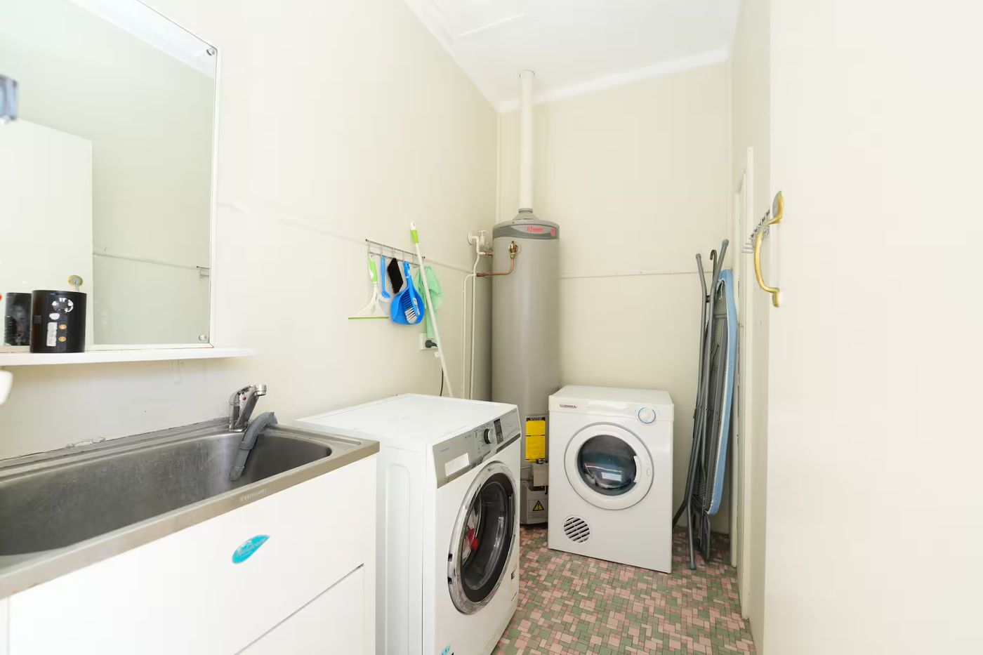 Laundry with a tub, washing machine and dryer