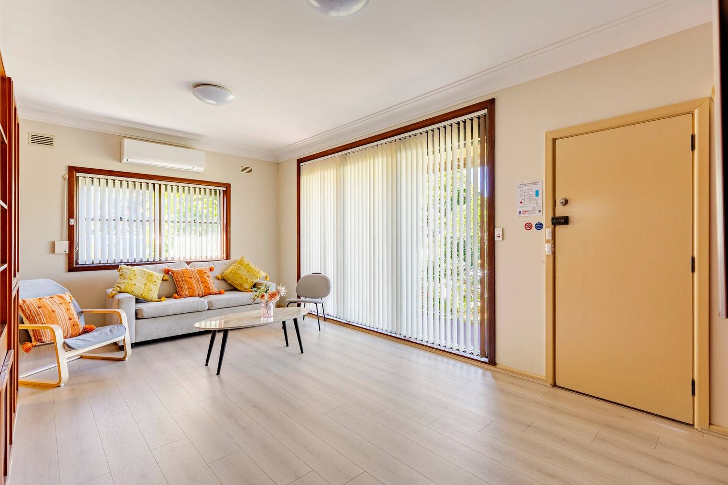 Lounge room by the front door with full-height windows
