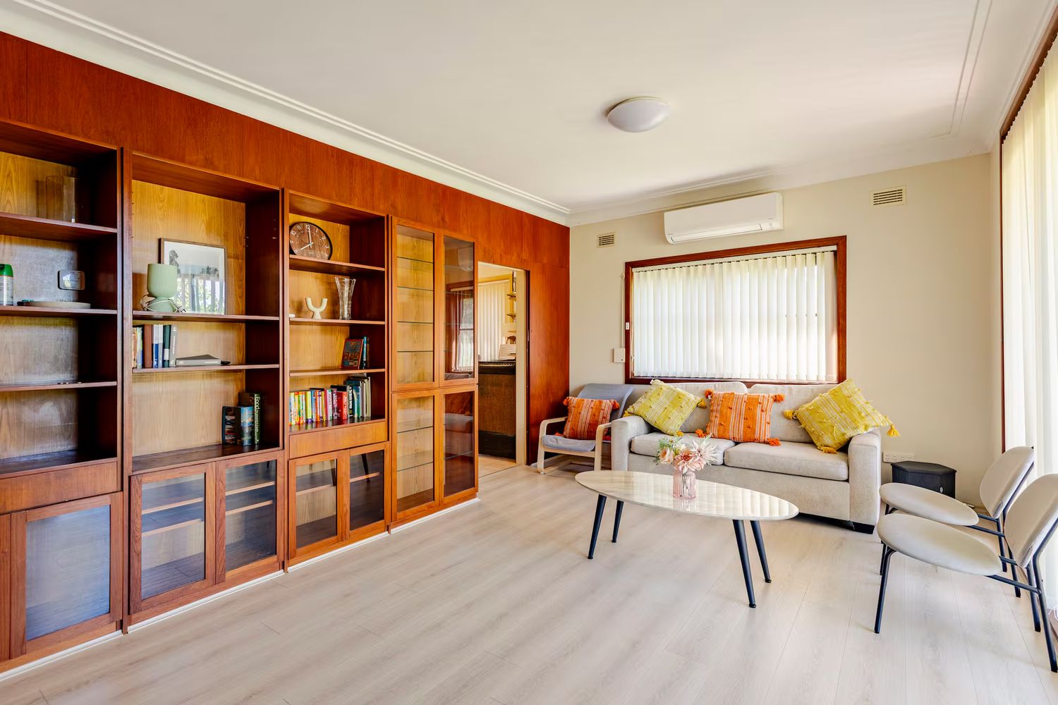 Lounge with built-in shelving and a sofa
