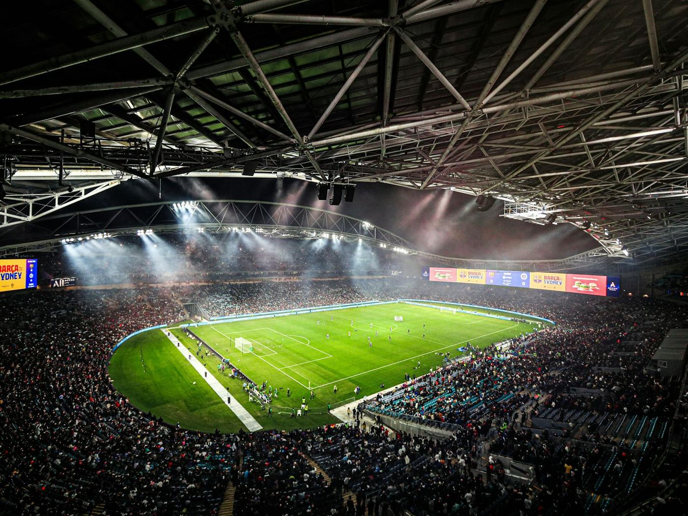 A packed stadium at Sydney Olympic Park at night